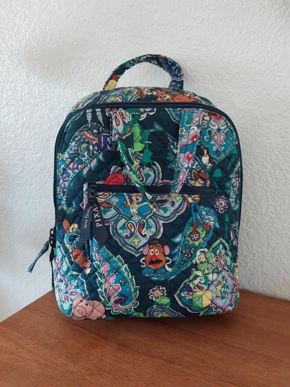 Disney vera bradley Pixar backpack with colorful cartoon characters and paisley